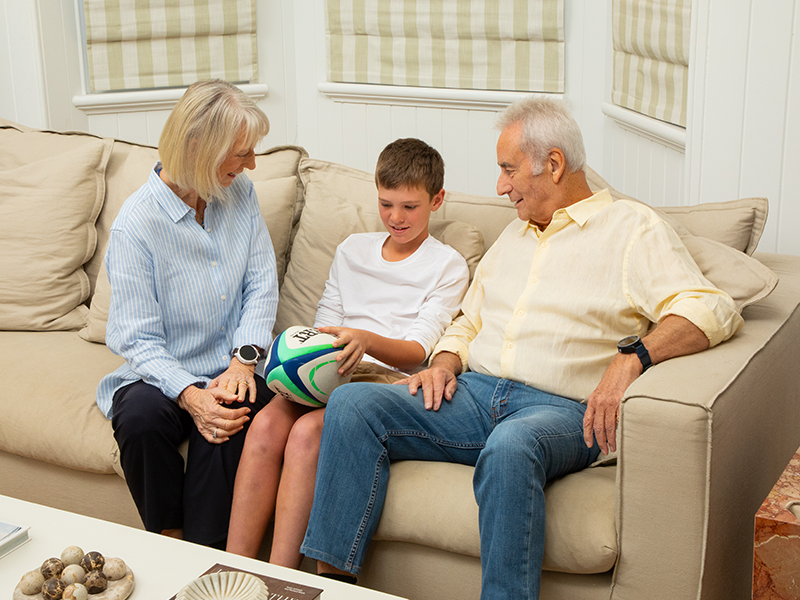 Grandparents with grandson enjoying family time wearing LiveLife watch
