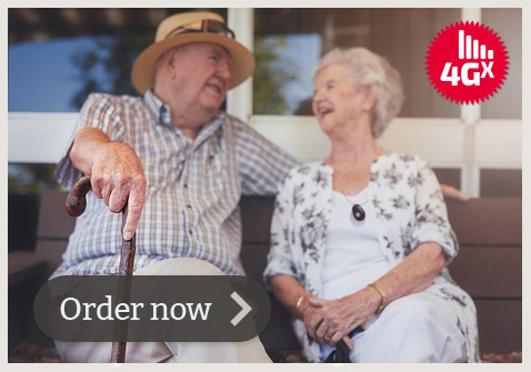 Photo of elderly Australian couple wearing Live Life Pendant around their necklace using the provided Lanyard