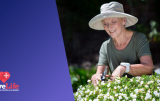 Senior lady gardening, wearing a livelife pendant.