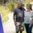 Senior couple walking at the park, wearing the LiveLife Watch